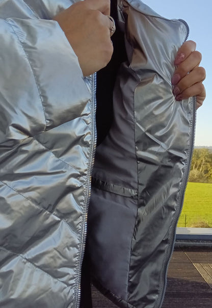 Close-up of silver quilted Laura Jo raincoat from Le Petit Placard with inner pocket detail