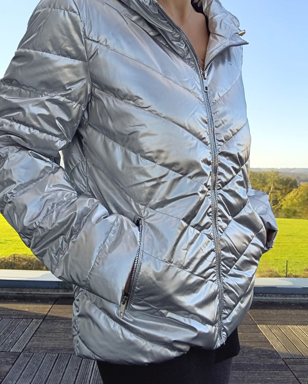 Woman wearing a silver Laura Jo puffer jacket outdoors, Le Petit Placard fashion