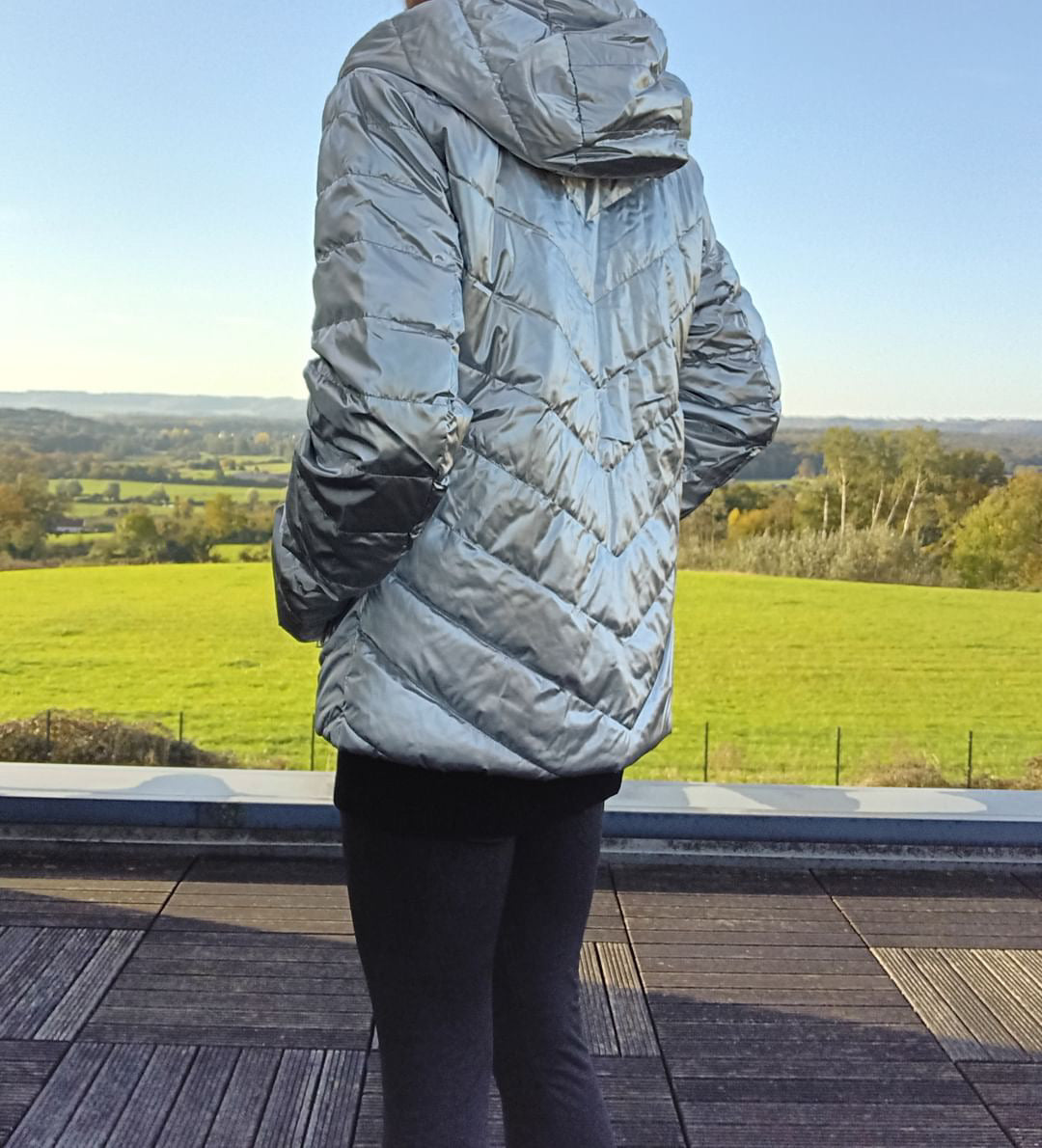 Silver Laura Jo raincoat worn outdoors, modern style jacket from Le Petit Placard