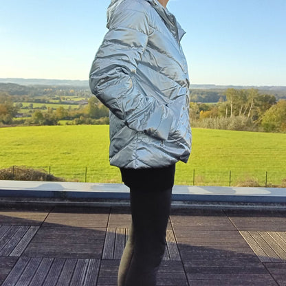 Woman in shiny silver Laura Jo raincoat outdoors, Le Petit Placard fashion