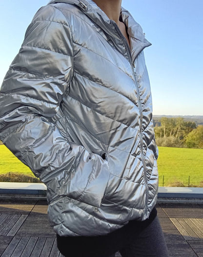 Woman wearing a silver Laura Jo puffer jacket outdoors, Le Petit Placard fashion