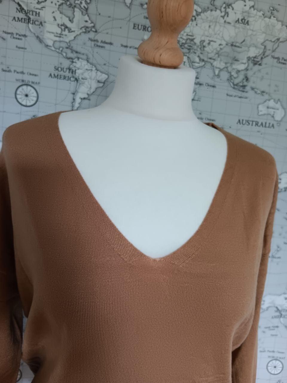 Camel V-neck Sarah John sweater on mannequin, Le Petit Placard, world map background