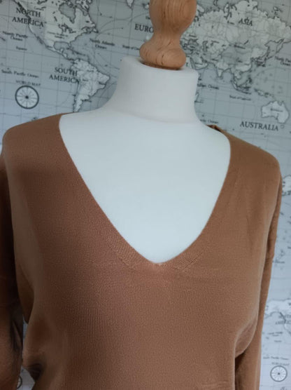 Camel V-neck Sarah John sweater on mannequin, Le Petit Placard, world map background