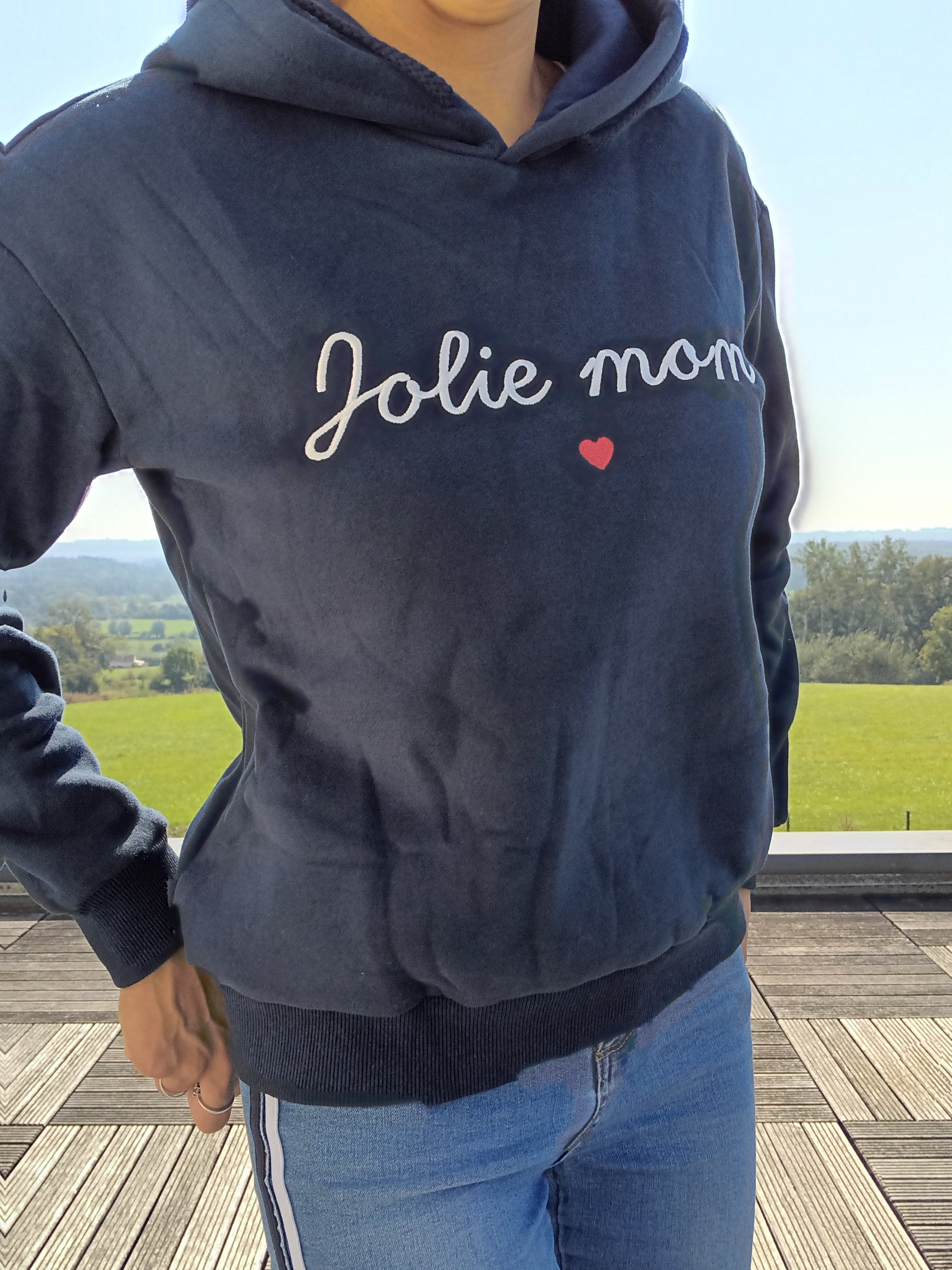 Navy blue 'Jolie mom' hoodie with heart detail, worn outdoors, Le Petit Placard fashion