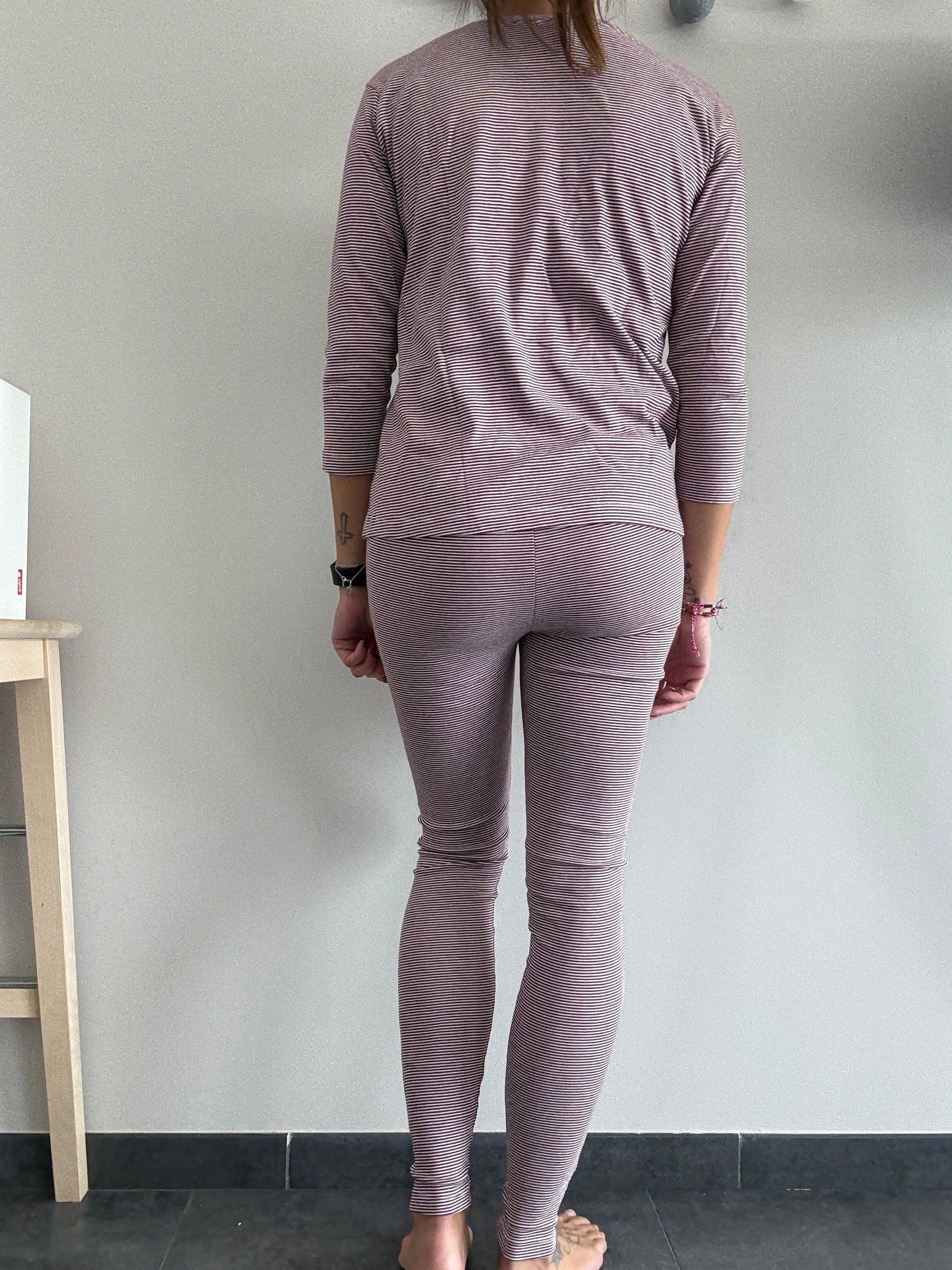 Woman wearing striped purple pajamas, standing barefoot indoors, Le Petit Placard fashion