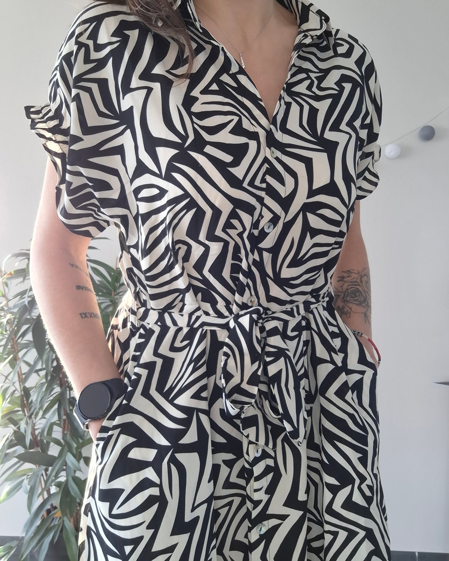 Woman wearing a black and white geometric patterned dress, Le Petit Placard fashion