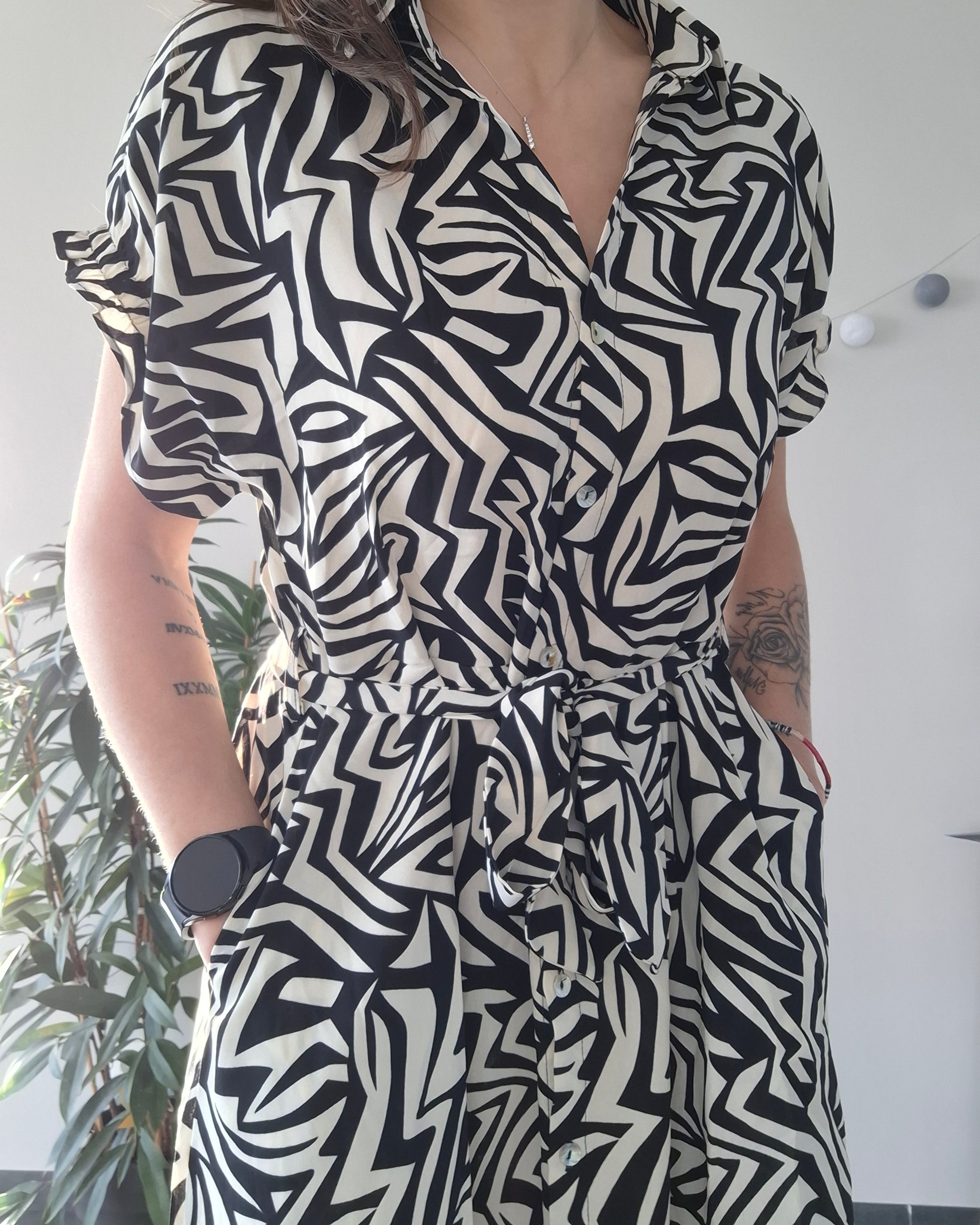 Woman wearing a black and white geometric patterned dress, Le Petit Placard fashion