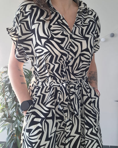 Woman wearing a black and white geometric patterned dress, Le Petit Placard fashion