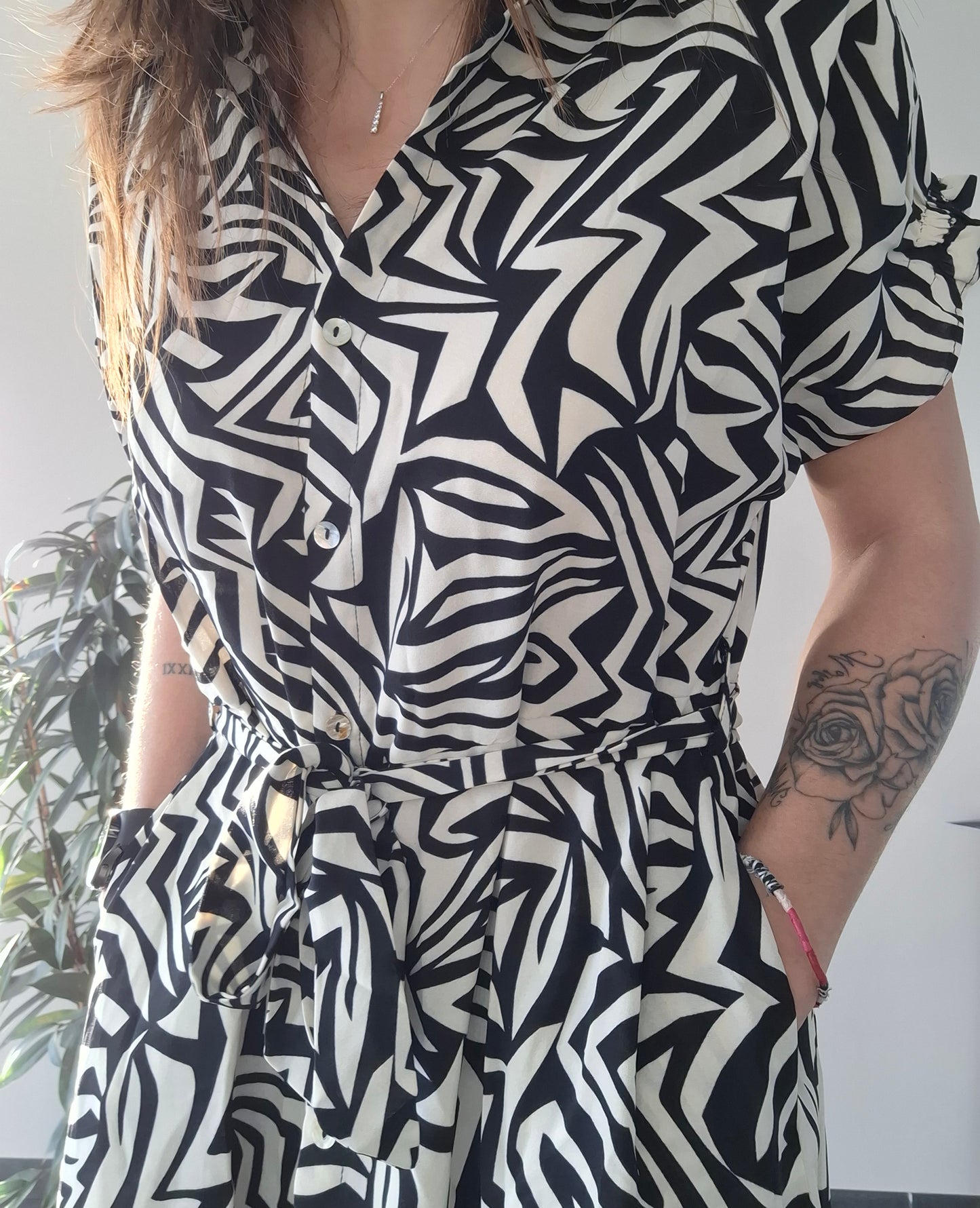 Woman wearing a black and white geometric dress with pockets, Le Petit Placard fashion