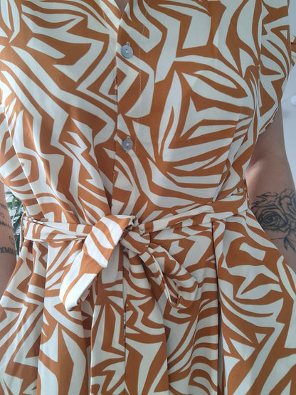 Orange and white geometric print dress with belt, Le Petit Placard fashion accessory.