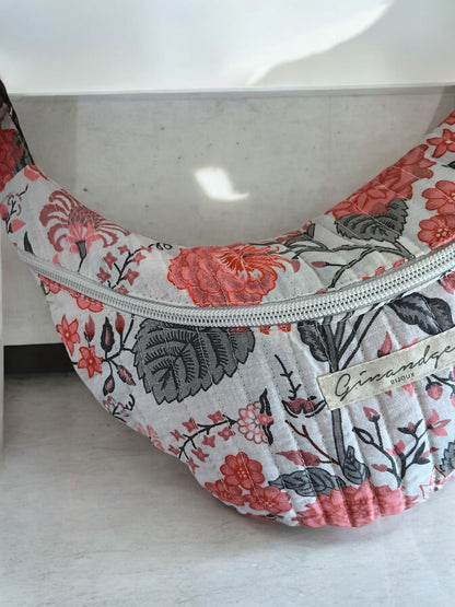 Floral quilted belt bag with zipper, pink and grey pattern, displayed at Le Petit Placard