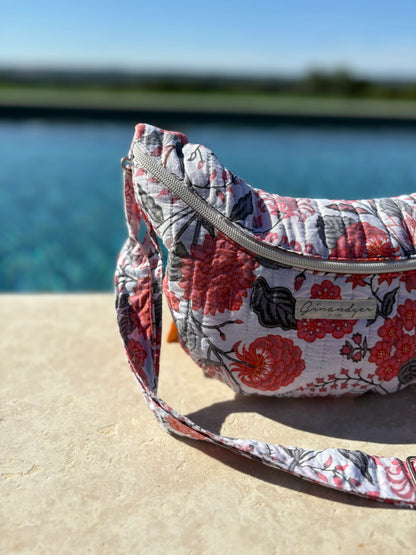 Floral quilted sac banane by Le Petit Placard on poolside, summer accessory trend