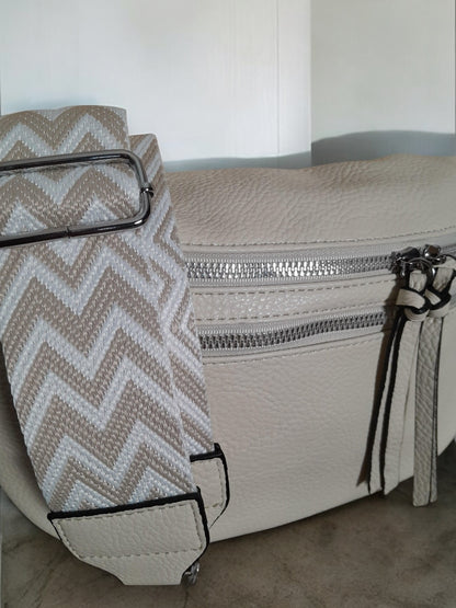 Beige faux leather bum bag with chevron strap and silver zippers from Le Petit Placard