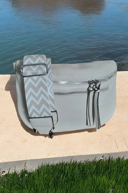 Trendy light gray bum bag with chevron strap on stone by water, Le Petit Placard accessories