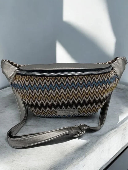 Trendy zigzag pattern belt bag with metallic strap on a marble surface, Le Petit Placard accessories
