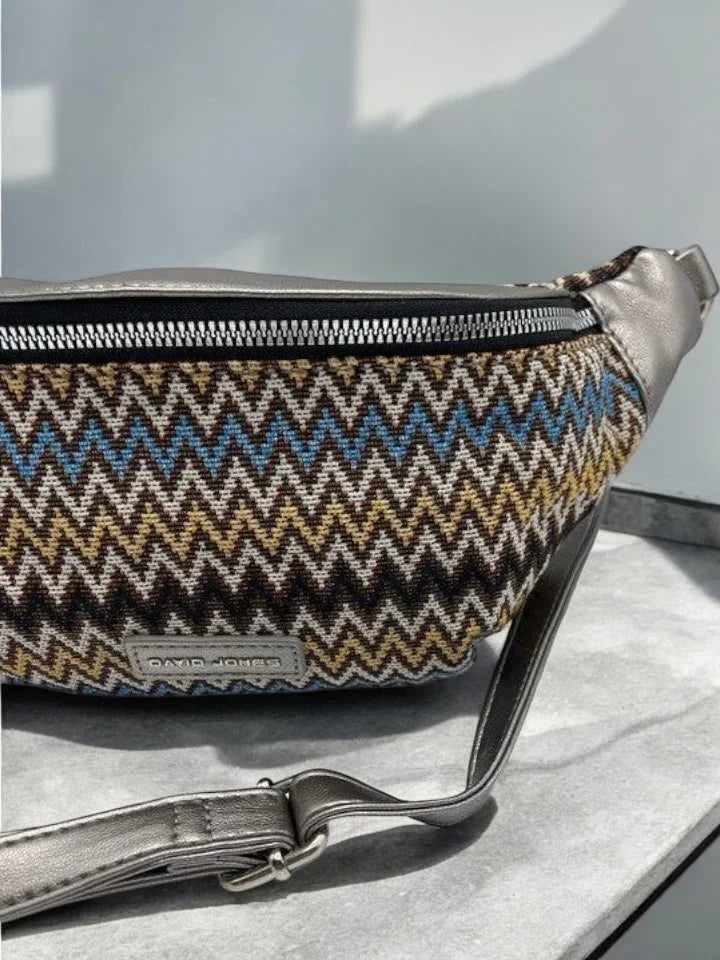 Chevron patterned David Jones banana bag with metallic strap on marble surface, Le Petit Placard