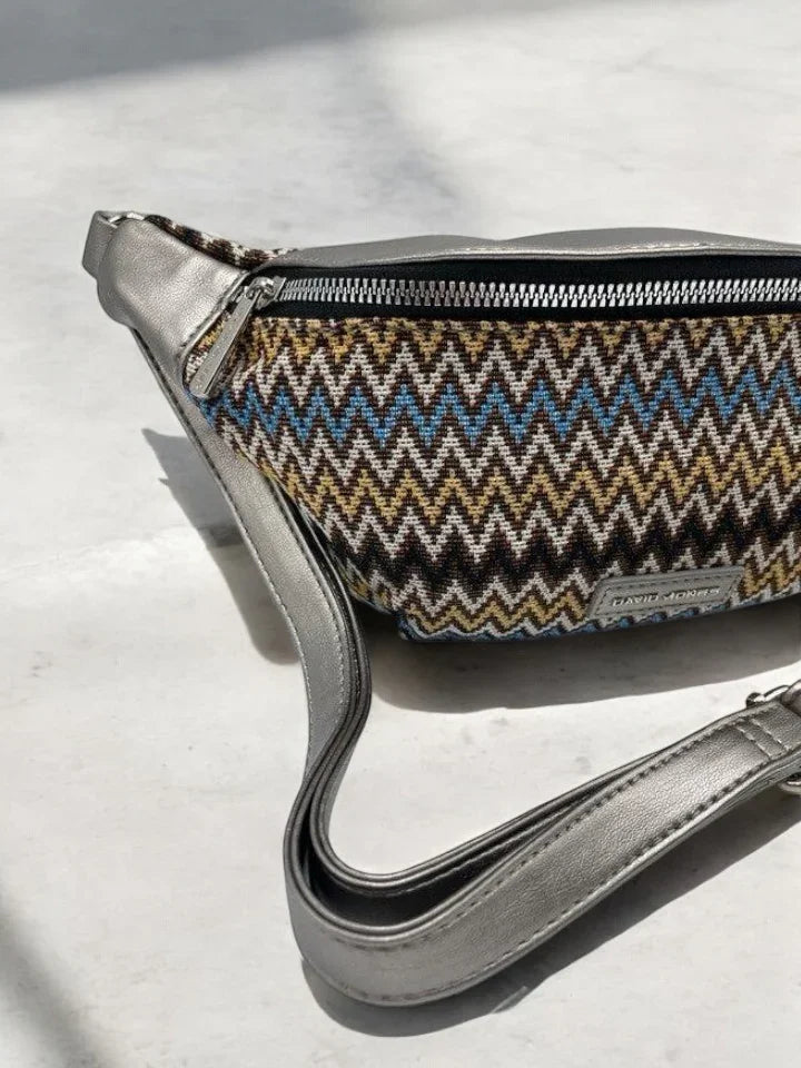 Trendy zigzag patterned sac banane with metallic strap on light surface, Le Petit Placard accessory