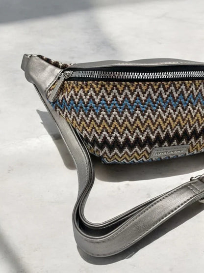 Trendy zigzag patterned sac banane with metallic strap on light surface, Le Petit Placard accessory