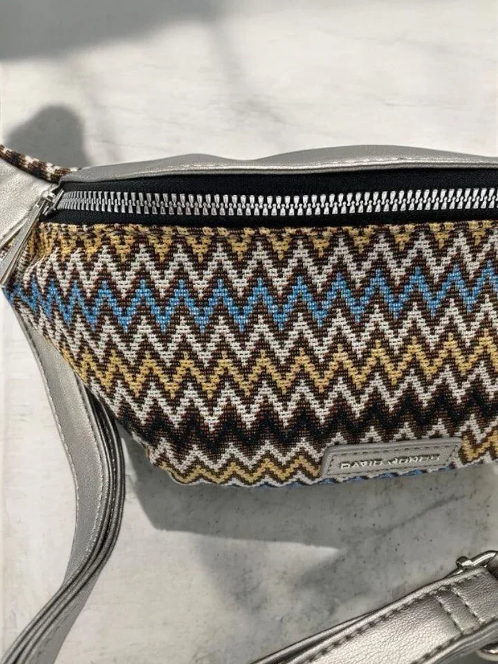 Colorful zigzag patterned David Jones belt bag with silver strap on marble surface, Le Petit Placard