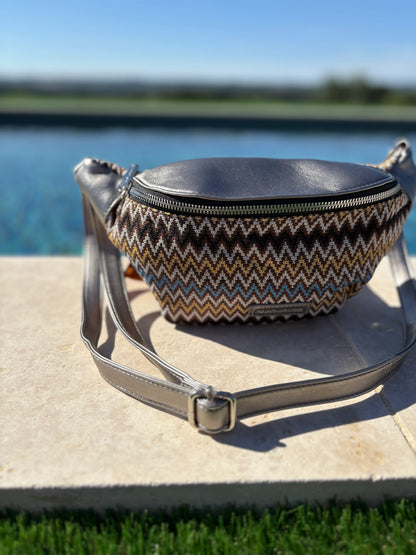 Trendy chevron-patterned sac banane with leather top by a pool, Le Petit Placard fashion accessory
