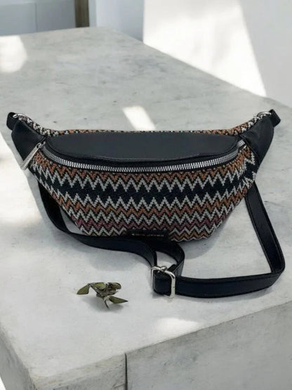Trendy zigzag-patterned sac banane with black leather trim on a stone surface, Le Petit Placard.