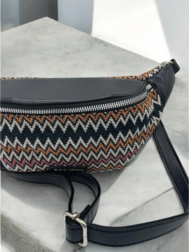 Trendy zigzag patterned belt bag with black leather strap on concrete surface, Le Petit Placard
