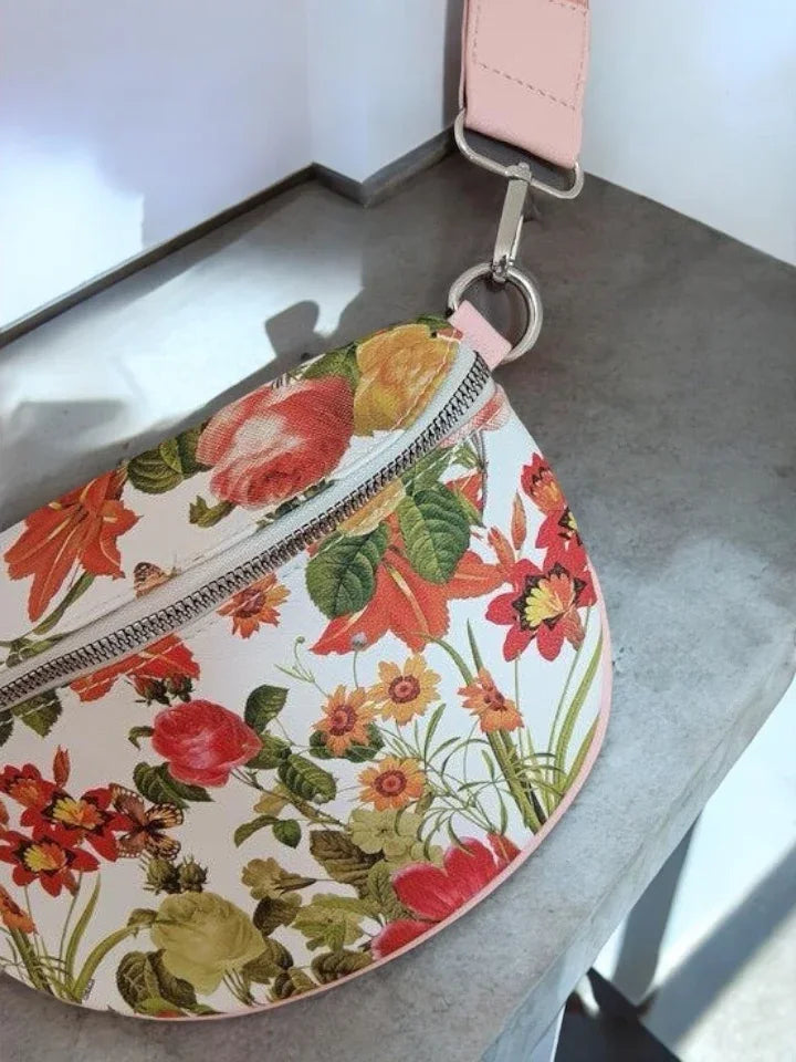 Floral print sac banane with pink strap on concrete surface, Le Petit Placard accessory