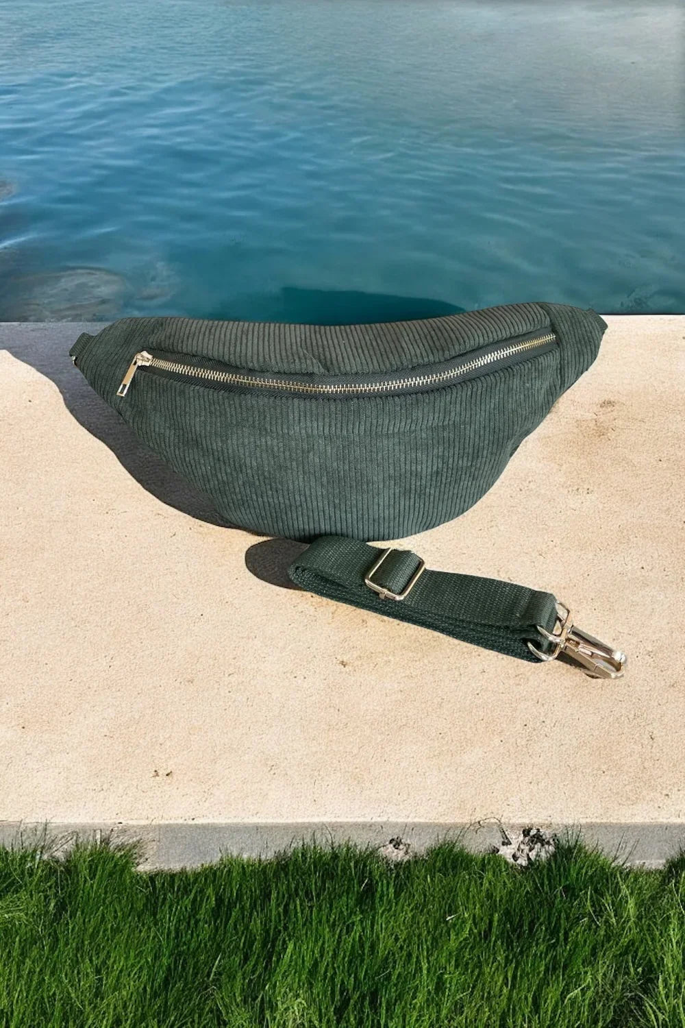 Green corduroy fanny pack with gold zipper and strap by pool, Le Petit Placard accessories