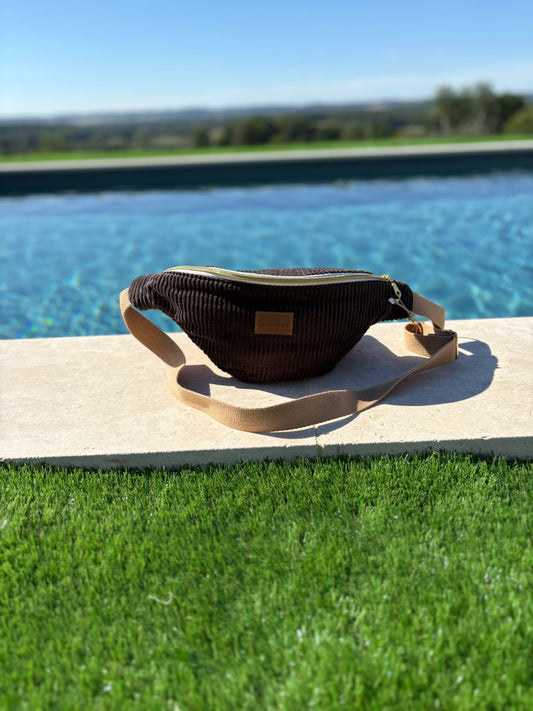 Brown corduroy bum bag with tan strap by a pool, Le Petit Placard accessories