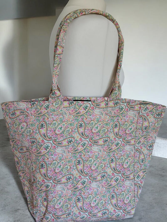 Large tote bag with pink and green paisley pattern, displayed on a mannequin, Escandelle brand, Le Petit Placard accessories
