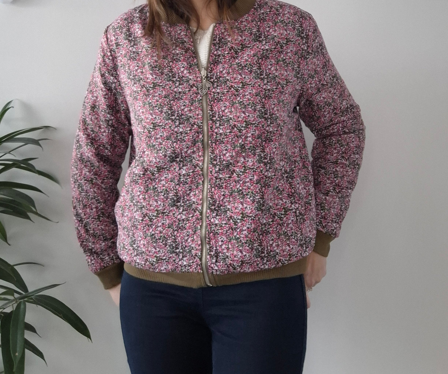 Woman wearing a pink floral Laura Jo jacket from Le Petit Placard, casual style