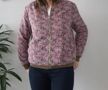 Woman wearing a pink floral Laura Jo jacket from Le Petit Placard, casual style