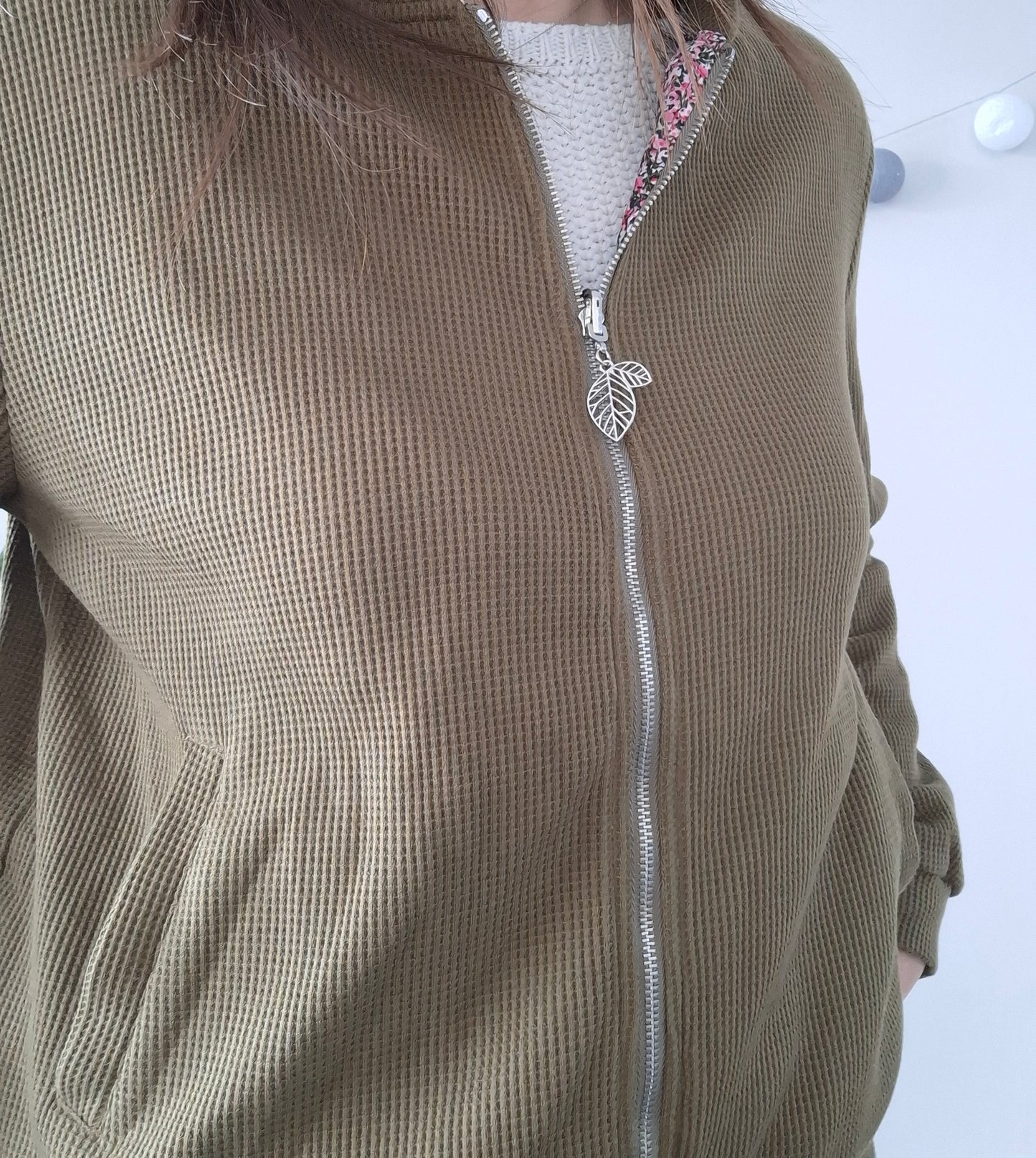 Woman wearing a khaki textured Laura Jo jacket with leaf zipper, Le Petit Placard fashion