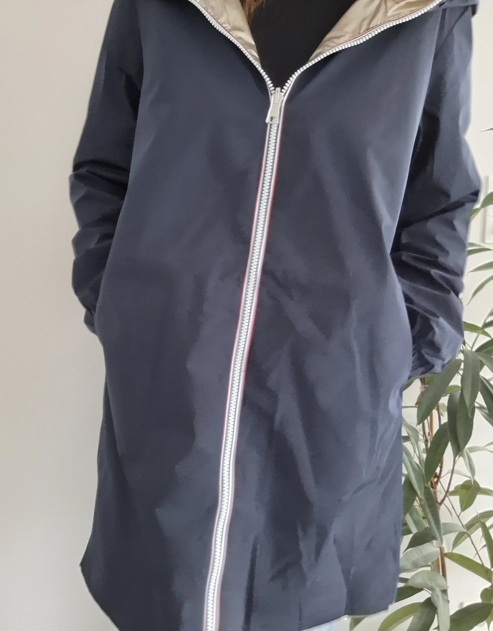 Navy blue Laura Jo raincoat with zip, worn by woman, Le Petit Placard collection