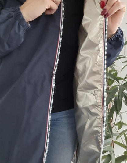 Woman modeling navy Laura Jo raincoat with silver lining, Le Petit Placard fashion.